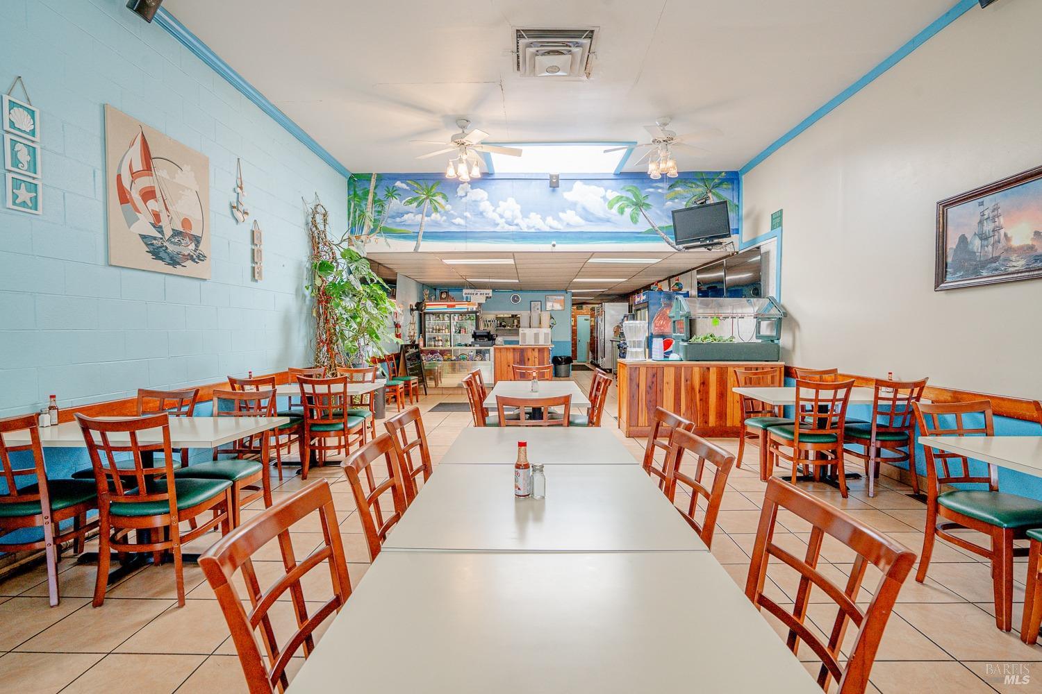 111 South State Street Ukiah, CA 95482 - Photo 6 of 14 a dining room with furniture and a chandelier