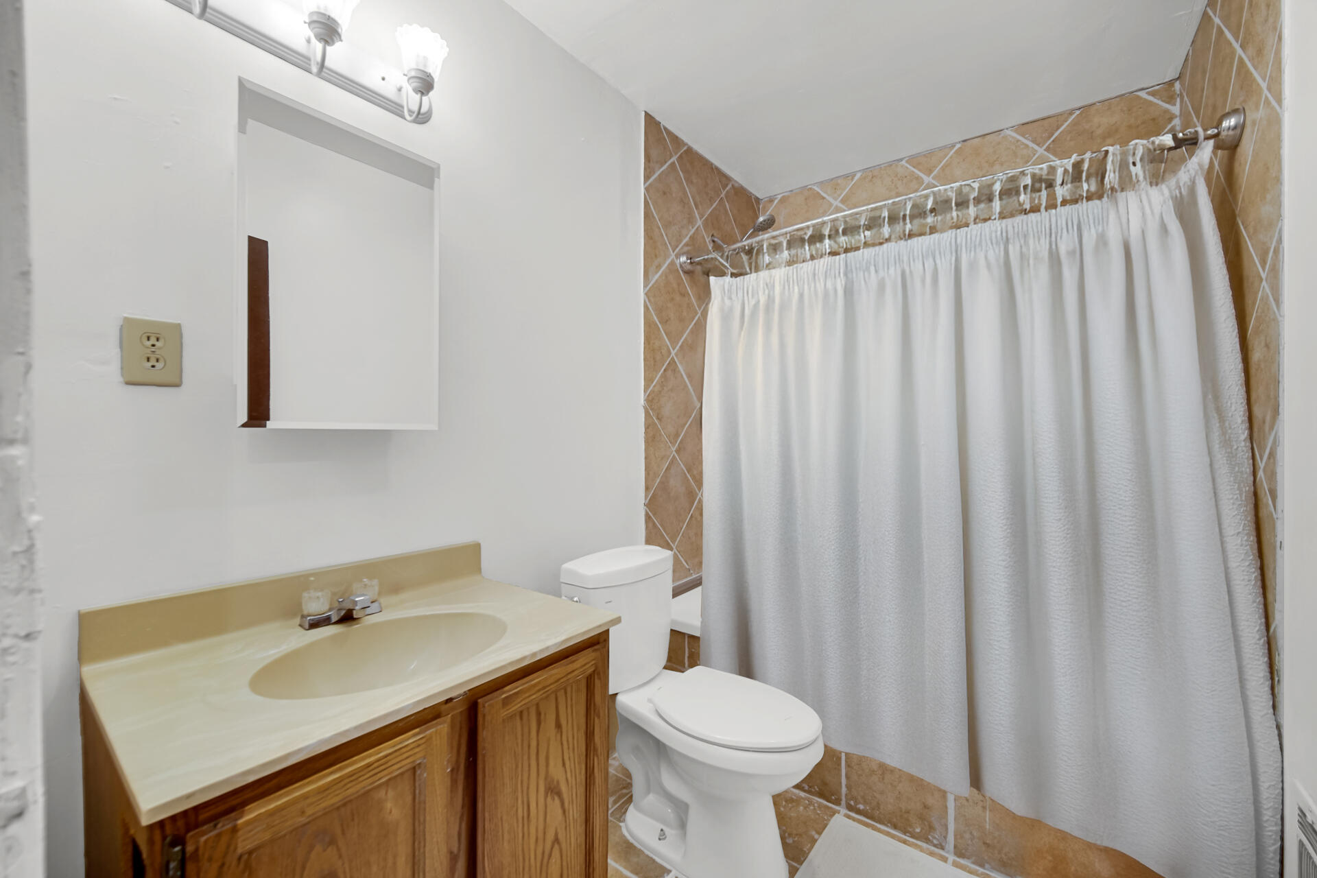 604 Weller Avenue La Porte, IN 46350 - Photo 19 of 26 a bathroom with a sink a toilet and shower