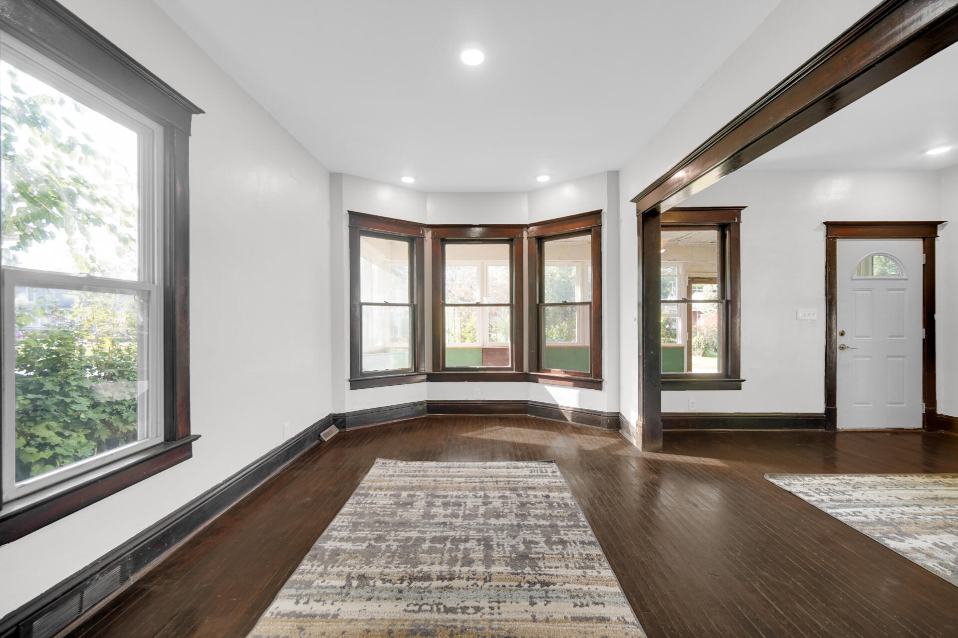 604 Weller Avenue La Porte, IN 46350 - Photo 6 of 26 a view of empty room with wooden floor and floor to ceiling window