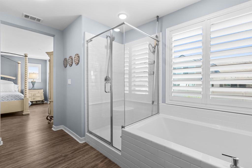 29809 Gypsy Vanner Way Menifee, CA 92584 - Photo 33 of 45 a bathroom with a tub and shower