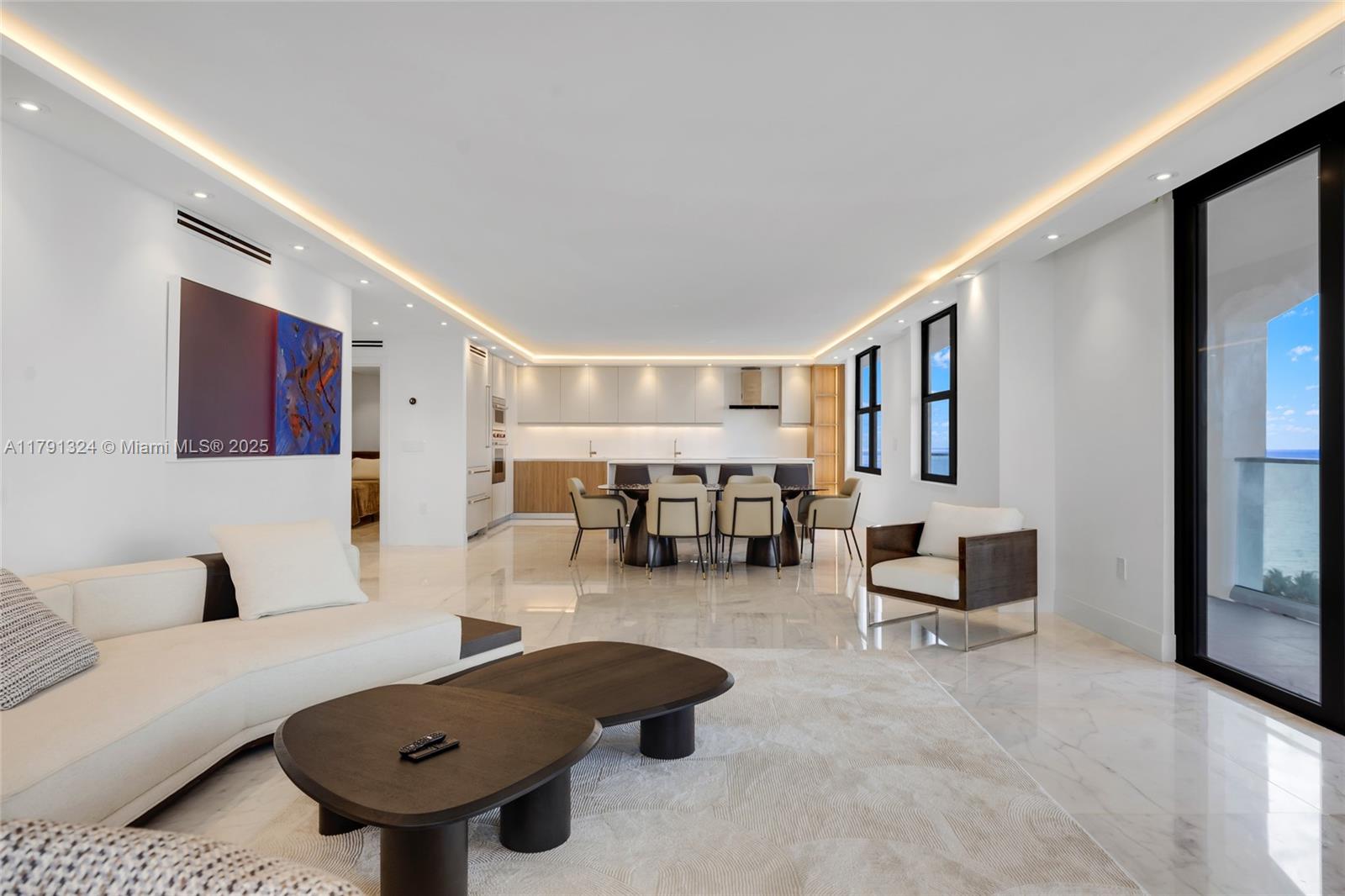 9801 Collins Avenue, Unit 17R Bal Harbour, FL 33154 - Photo 14 of 46 a living room with furniture and a table