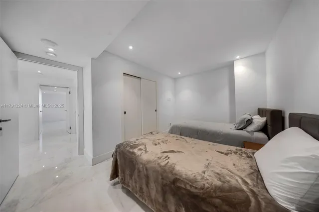 a bedroom with a bed and a walk in closet