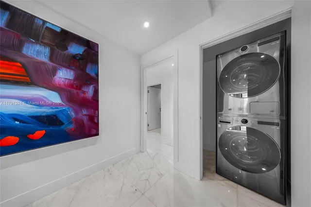 a view of a hallway with washer and dryer
