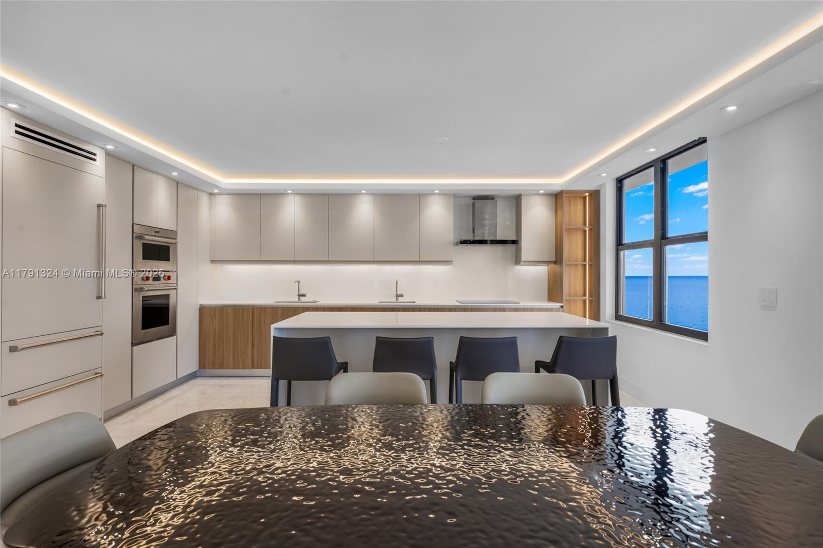 9801 Collins Avenue, Unit 17R Bal Harbour, FL 33154 - Photo 3 of 46 a view of kitchen with stainless steel appliances granite countertop a stove a sink and a refrigerator