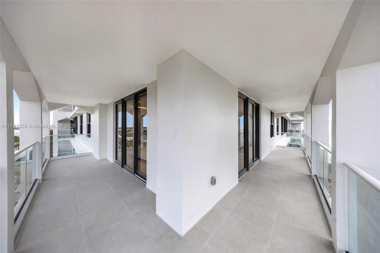 9801 Collins Avenue, Unit 17R Bal Harbour, FL 33154 - Photo 36 of 46 a view of a hallway with closet and a couch