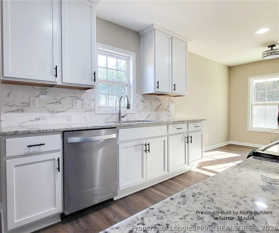 973 Martin Road St. Pauls, NC 28384 - Photo 4 of 19 Functional kitchen layout with built-in sink window and modern flow.