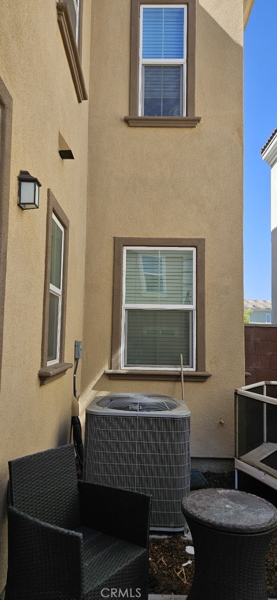 8787 Wanderlin Place Chino, CA 91708 - Photo 11 of 14 a brick fireplace with a sink and a mirror