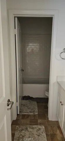 a bathroom with a glass door shower