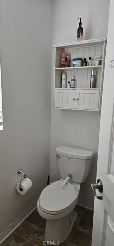 a bathroom with a toilet and a sink