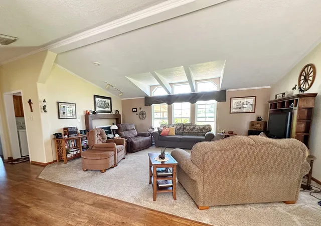 a bedroom with a large bed and furniture