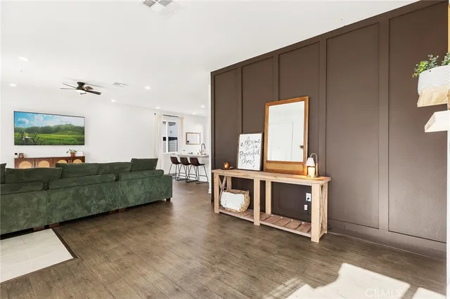 a bedroom with a balcony a bed and a chandelier