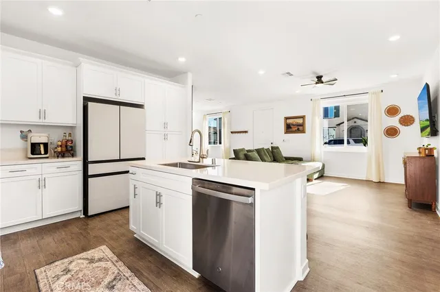 a kitchen with a sink appliances and a window