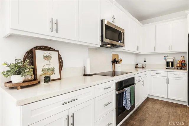 a kitchen with appliances and cabinets