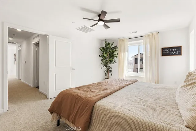 a bathroom with a double vanity sink toilet and shower