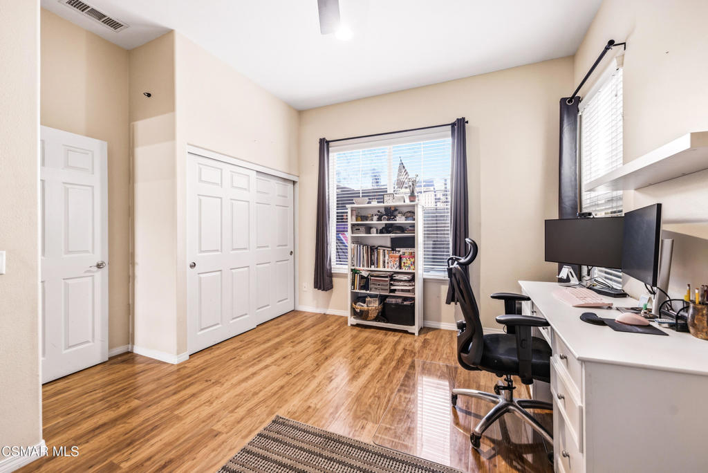 4741 Westwood Street Simi Valley, CA 93063 - Photo 17 of 50 a view of a workspace with furniture and wooden floor