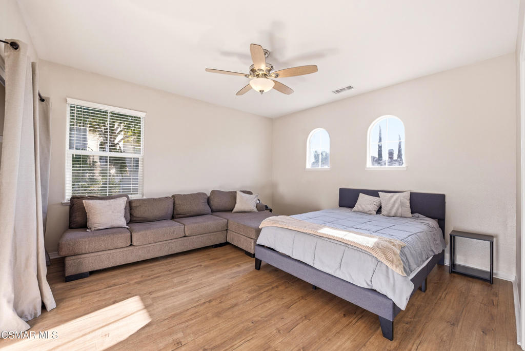 4741 Westwood Street Simi Valley, CA 93063 - Photo 35 of 50 a bedroom with a bed couch and window