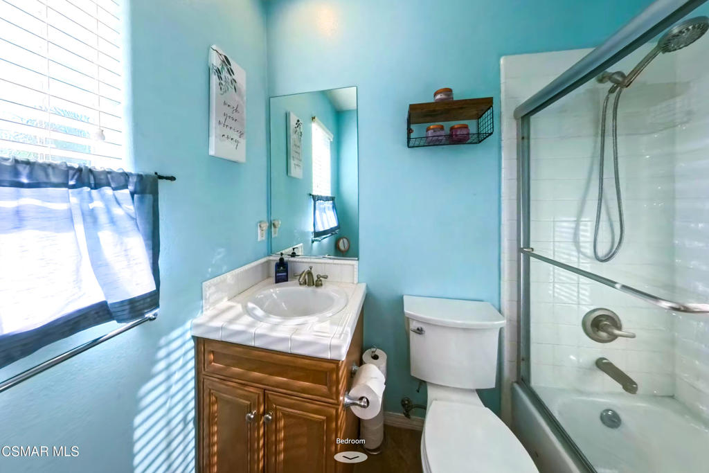 4741 Westwood Street Simi Valley, CA 93063 - Photo 36 of 50 a bathroom with a sink a toilet and shower