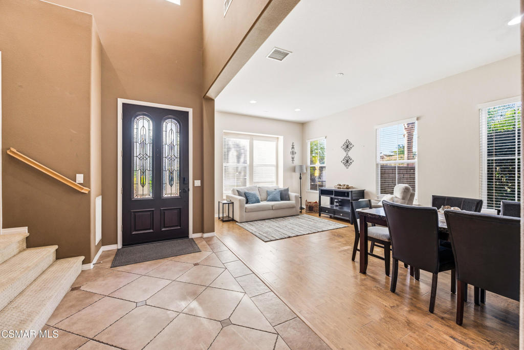 4741 Westwood Street Simi Valley, CA 93063 - Photo 6 of 50 a living room with furniture a dining table and large windows