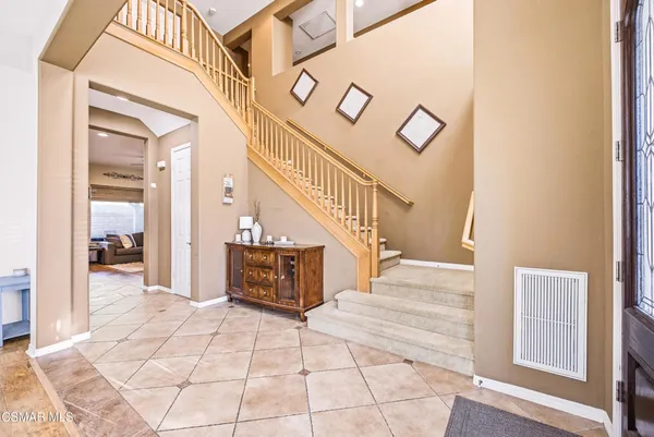 a view of entryway and hall with a front door
