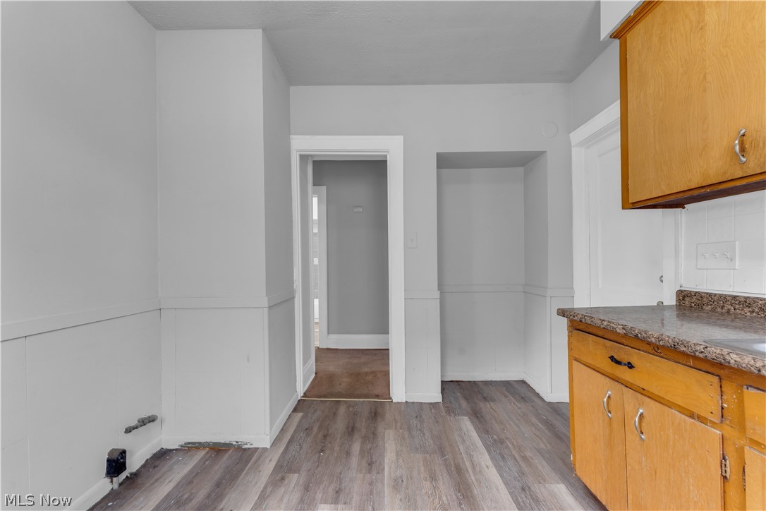 860 Greyton Road Cleveland Heights, OH 44112 - Photo 22 of 31 Kitchen featuring light hardwood / wood-style flooring and tasteful backsplash