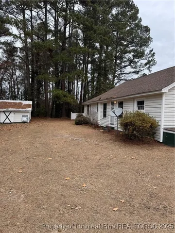 a view of a house with a outdoor space and porch
