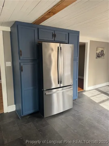 a white refrigerator freezer sitting in a kitchen