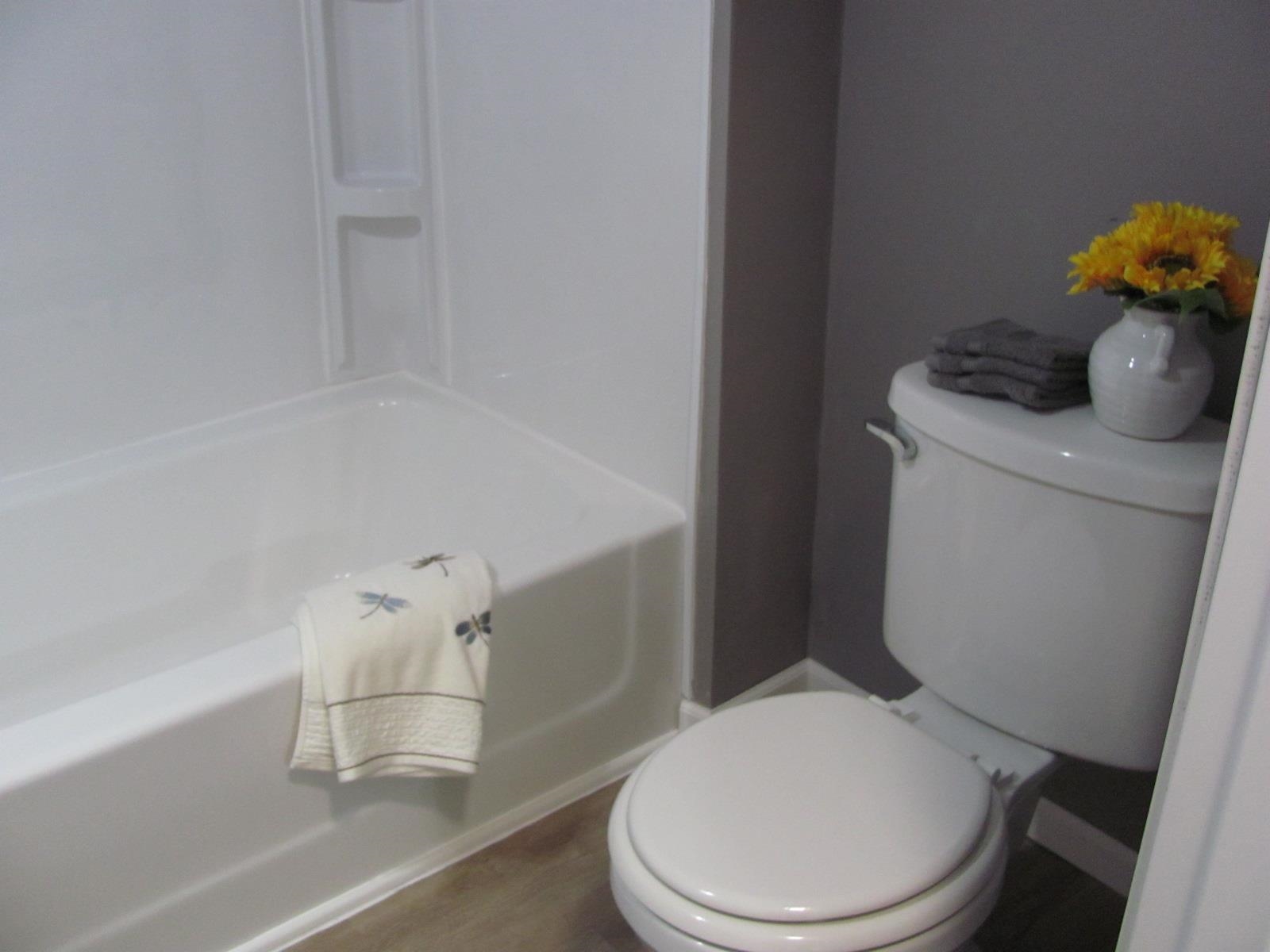 1817 Ridge Avenue Rockford, IL 61103 - Photo 17 of 48 a white toilet sitting next to a bath tub
