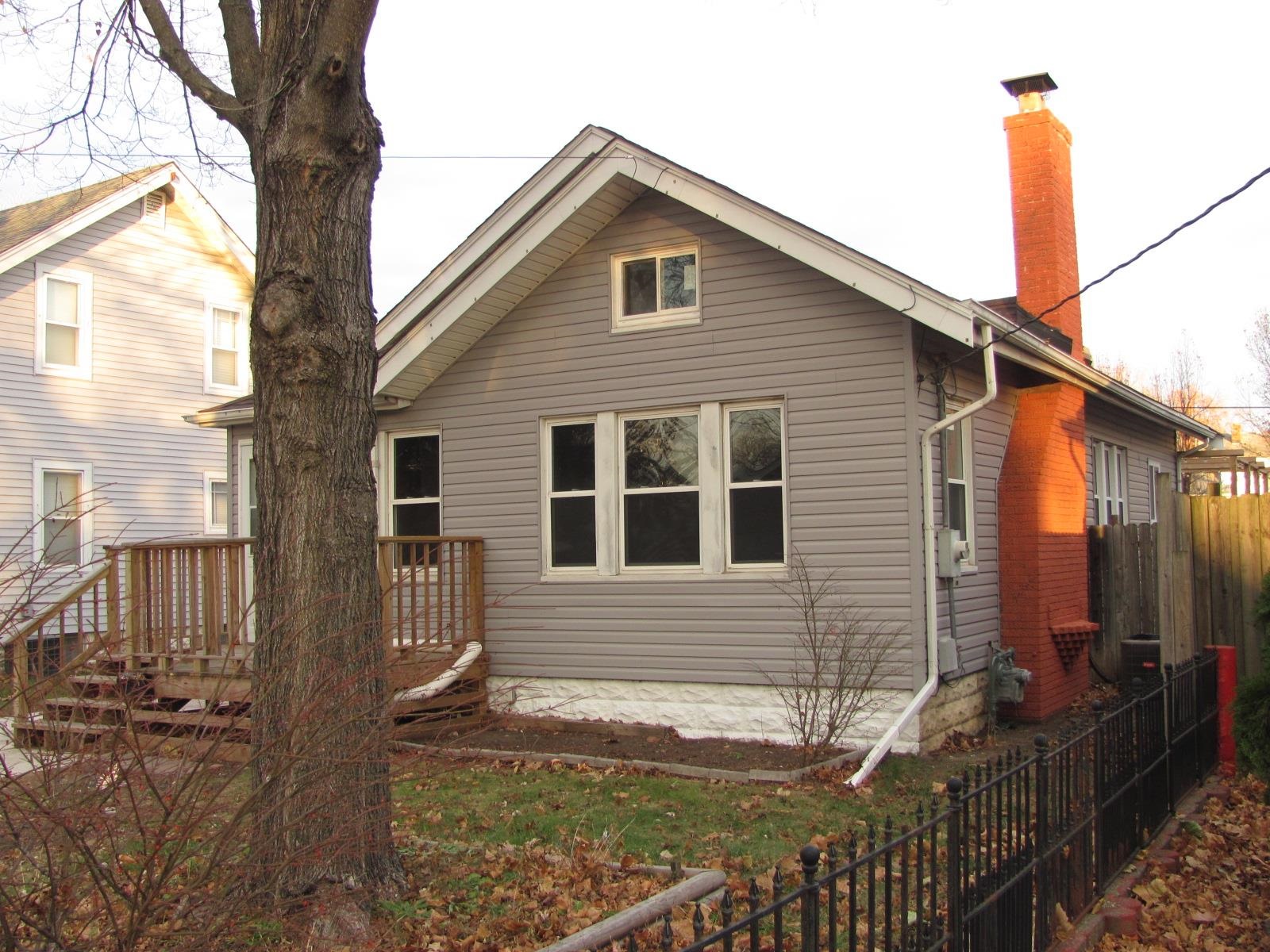 1817 Ridge Avenue Rockford, IL 61103 - Photo 2 of 48 a front view of a house with yard