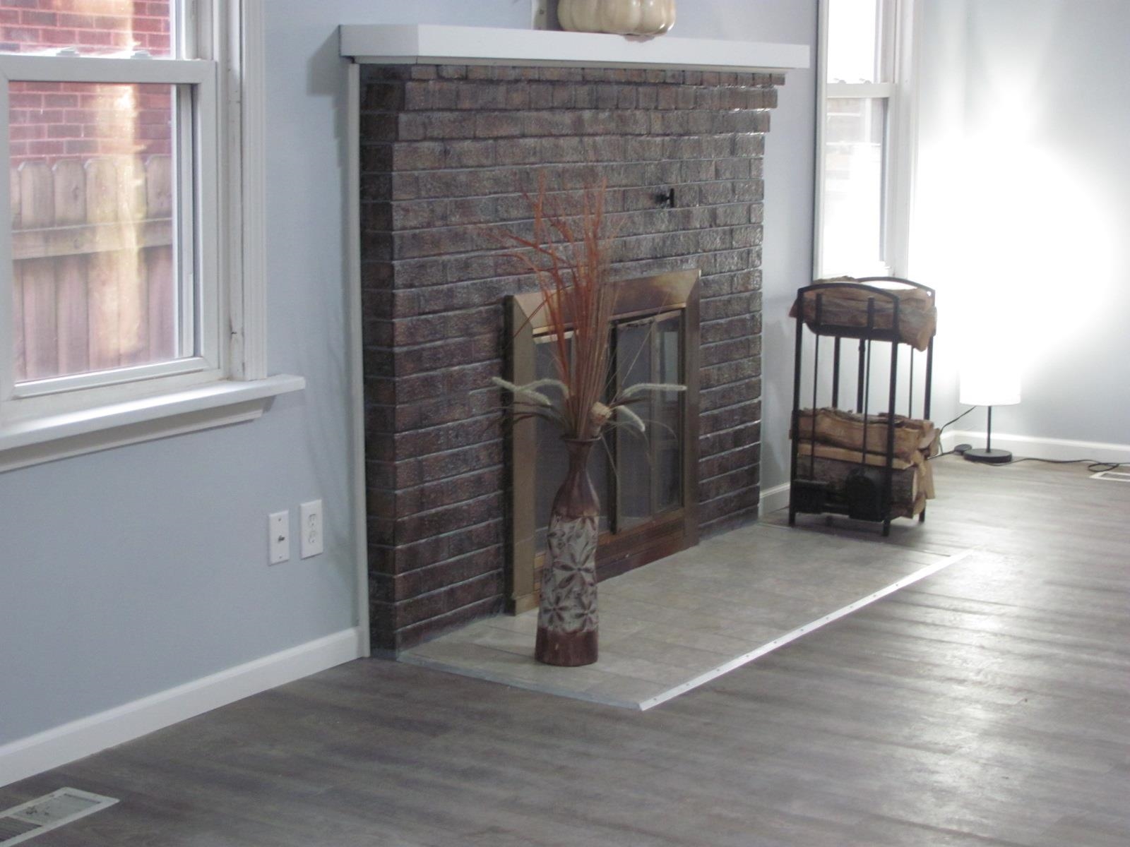 1817 Ridge Avenue Rockford, IL 61103 - Photo 23 of 48 a view of empty room with stairs and wooden floor