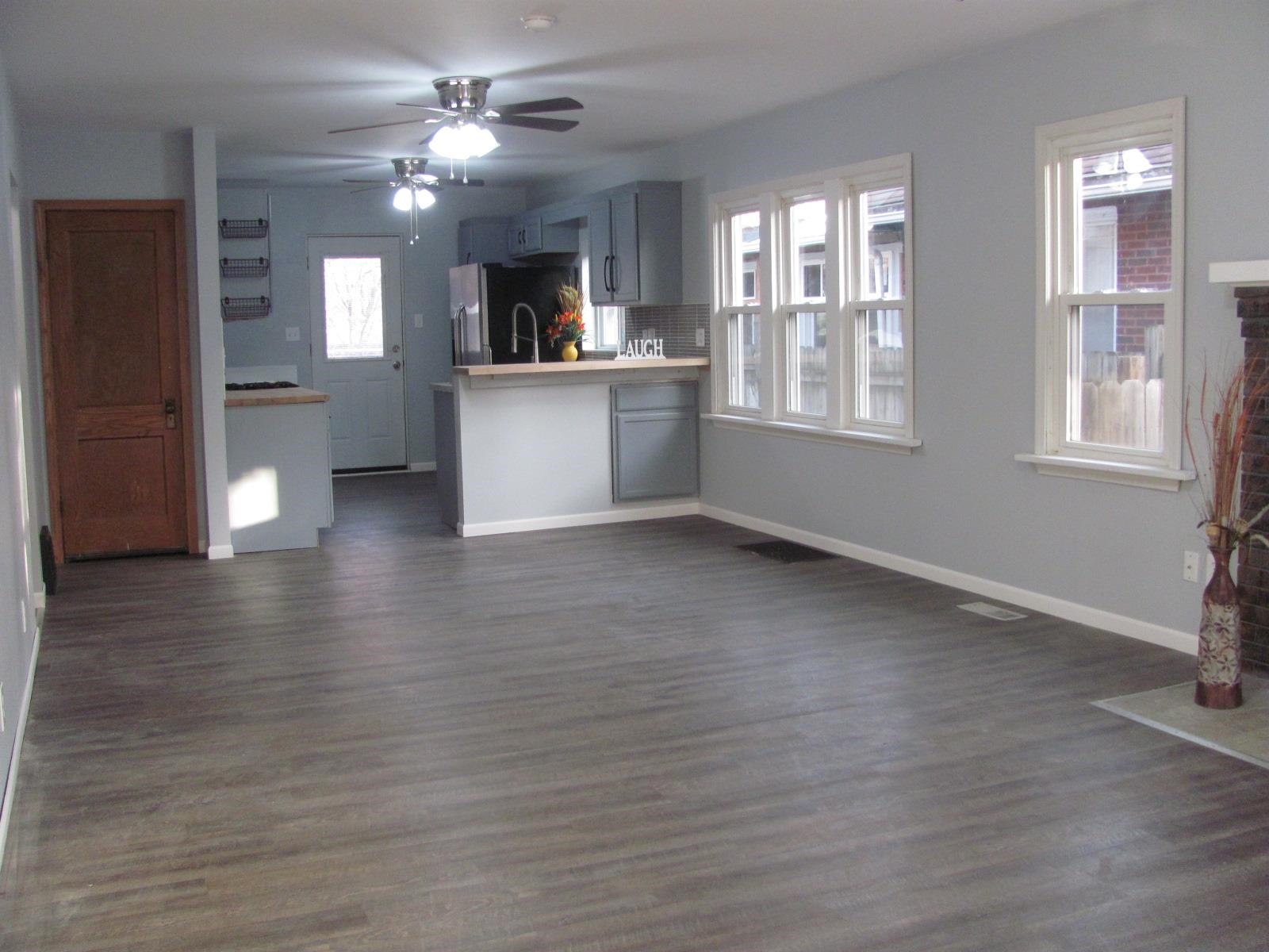 1817 Ridge Avenue Rockford, IL 61103 - Photo 3 of 48 a view of an empty room with window and wooden floor