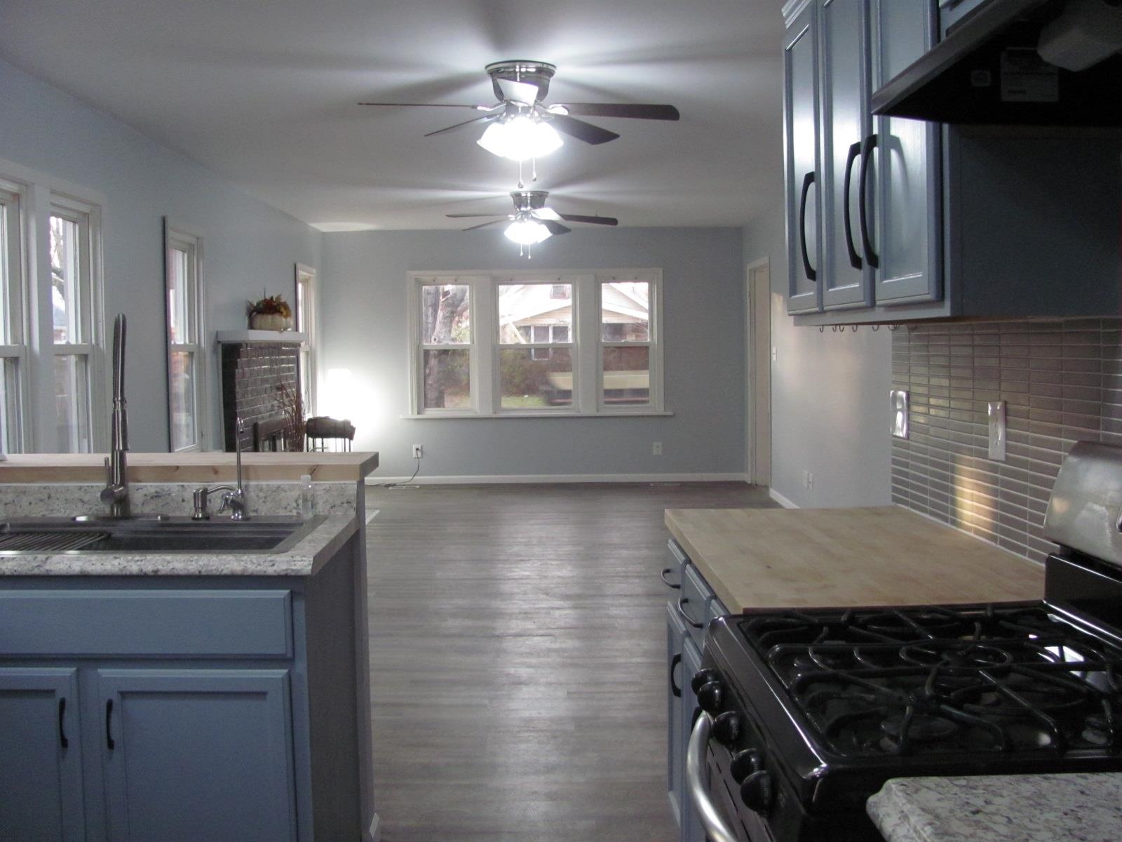 1817 Ridge Avenue Rockford, IL 61103 - Photo 4 of 48 a kitchen with kitchen island a counter space a sink and appliances