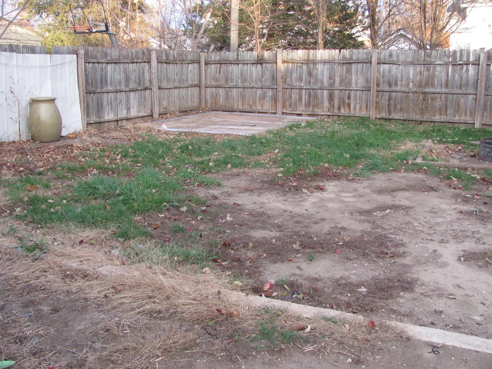 1817 Ridge Avenue Rockford, IL 61103 - Photo 44 of 48 a view of a backyard with large trees and wooden fence