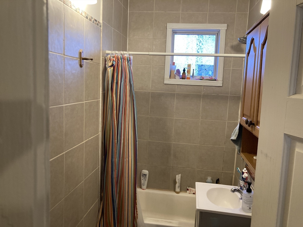 45 Gordon Street, Unit 4 Boston, MA 02134 - Photo 5 of 8 a bathroom with a shower and a sink