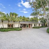 front view of a house with a garden
