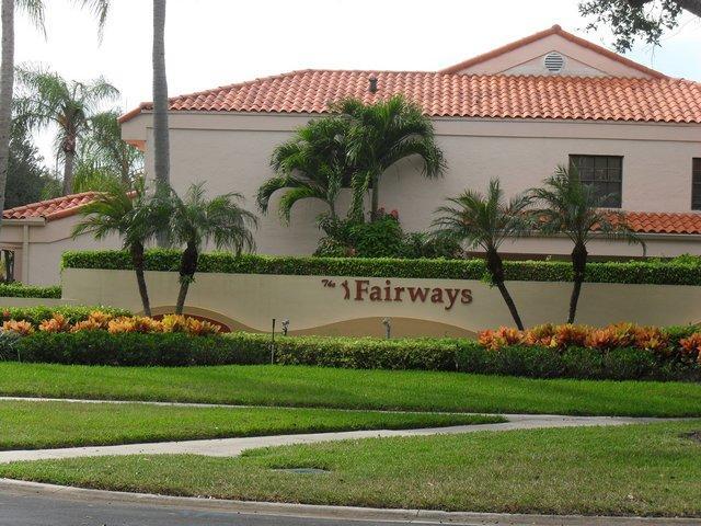 17340 Boca Club Boulevard, Unit 704 Boca Raton, FL 33487 - Photo 1 of 27 a sign on the side of a building
