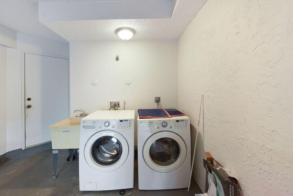 17340 Boca Club Boulevard, Unit 704 Boca Raton, FL 33487 - Photo 18 of 27 a utility room with dryer and washer