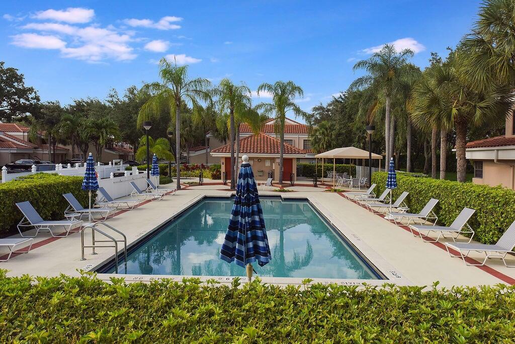 17340 Boca Club Boulevard, Unit 704 Boca Raton, FL 33487 - Photo 27 of 27 a view of a swimming pool with a patio