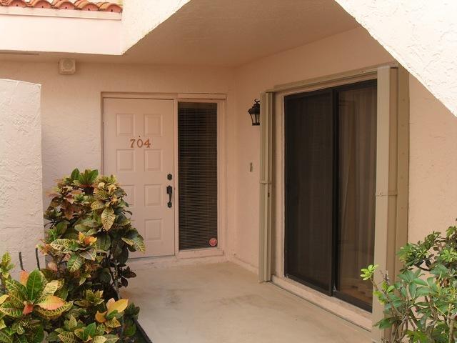 17340 Boca Club Boulevard, Unit 704 Boca Raton, FL 33487 - Photo 5 of 27 front view of a house