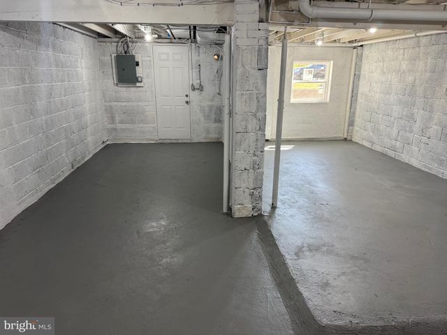 a view of a hallway with a window