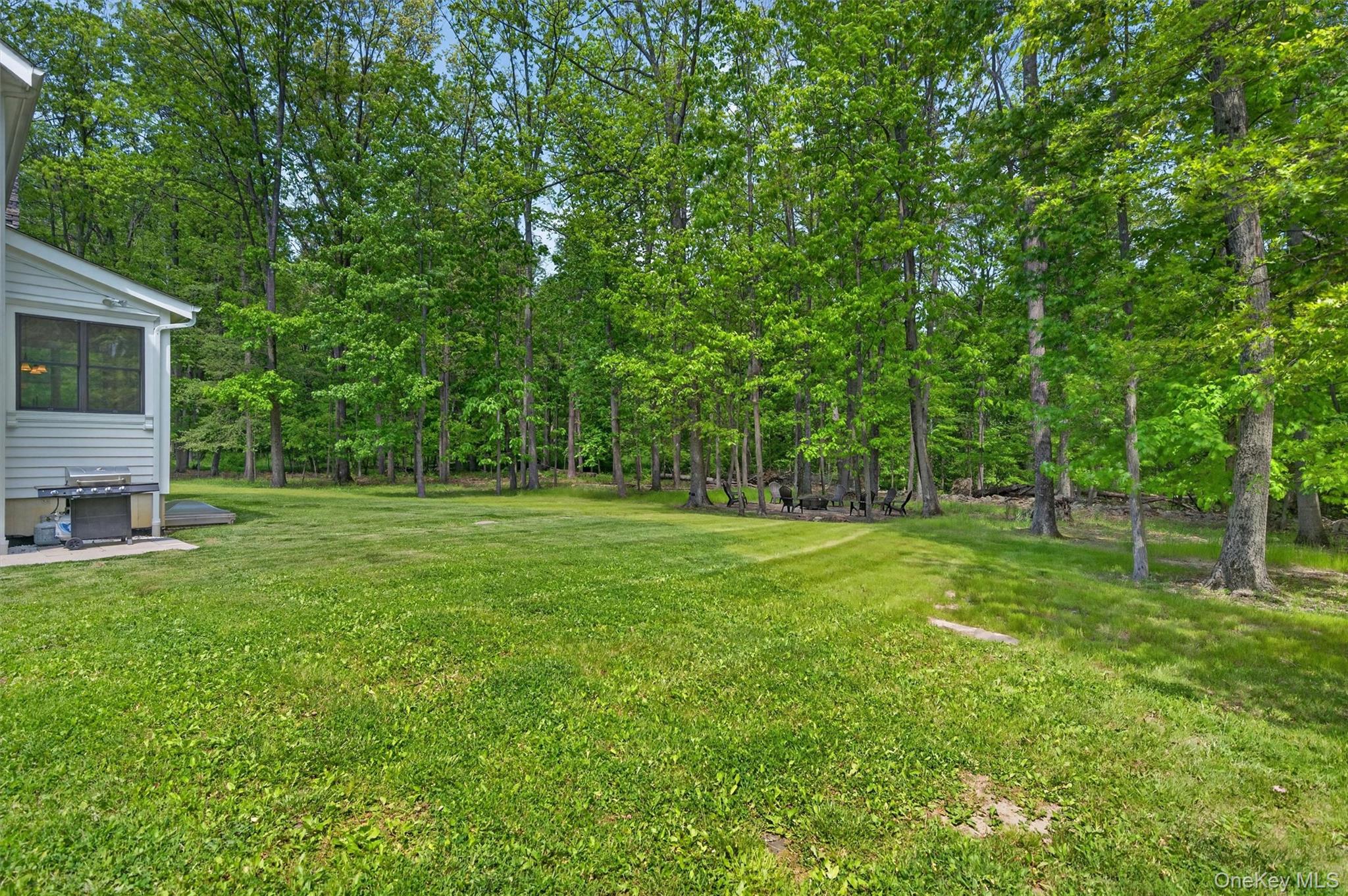 28 Bethlehem Road New Windsor, NY 12553 - Photo 47 of 50 a view of a backyard with a small cabin