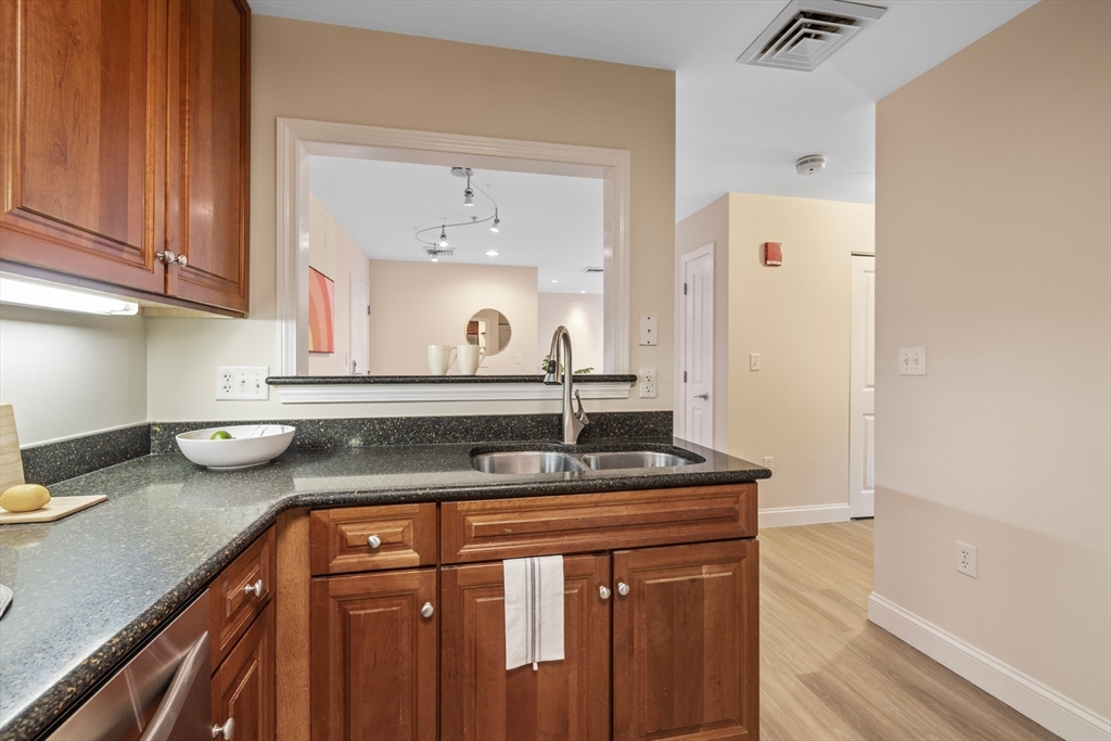 320 Rindge Avenue, Unit 303 Cambridge, MA 02140 - Photo 11 of 28 a kitchen with sink and cabinets