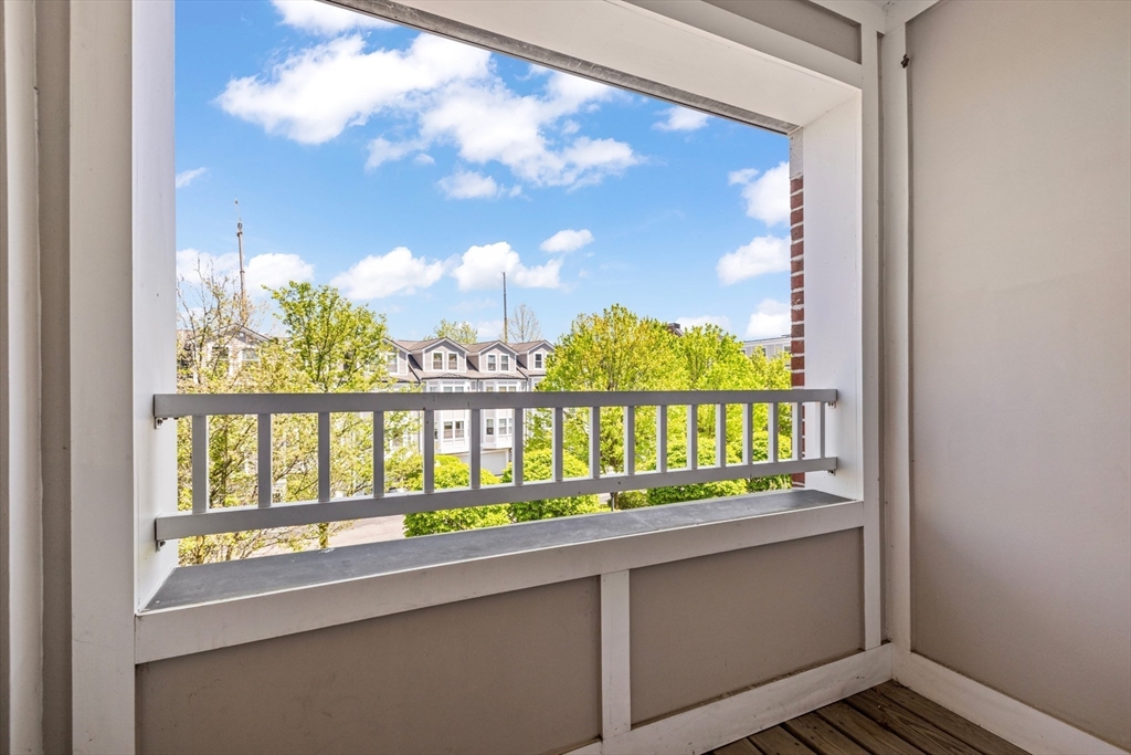 320 Rindge Avenue, Unit 303 Cambridge, MA 02140 - Photo 16 of 28 a view of a balcony from a window