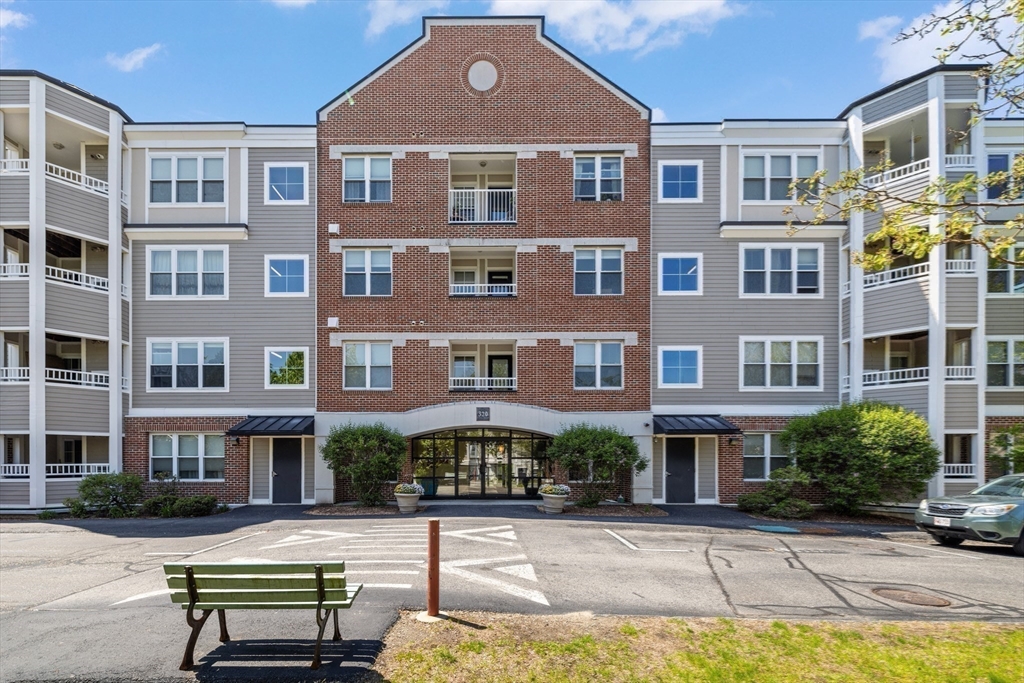 320 Rindge Avenue, Unit 303 Cambridge, MA 02140 - Photo 18 of 28 a front view of a building with a garden