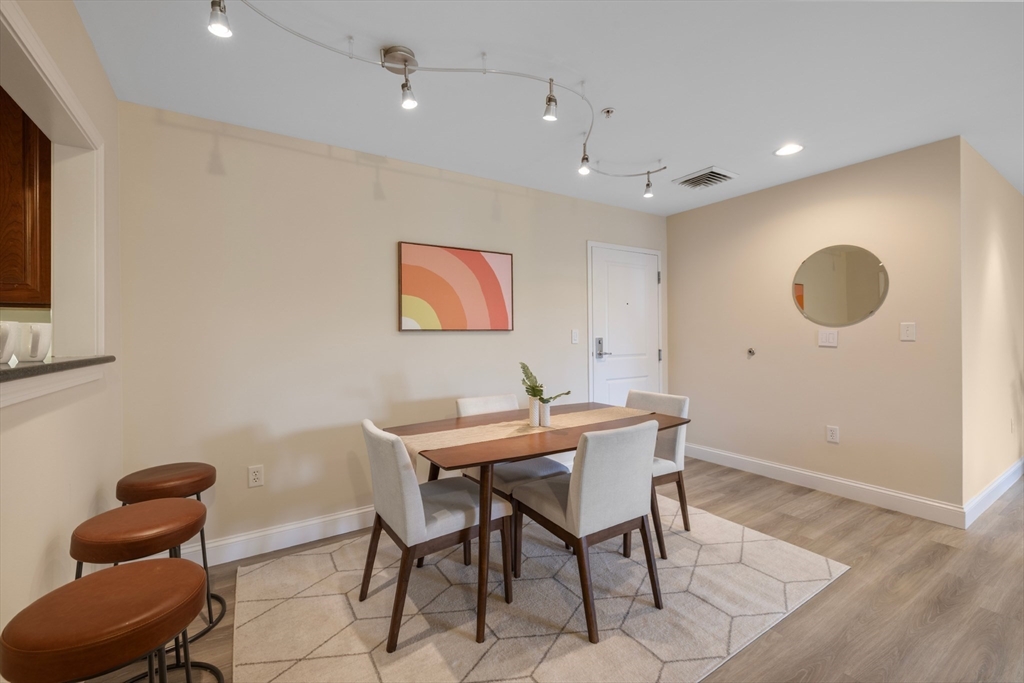 320 Rindge Avenue, Unit 303 Cambridge, MA 02140 - Photo 7 of 28 a view of a dining room with furniture