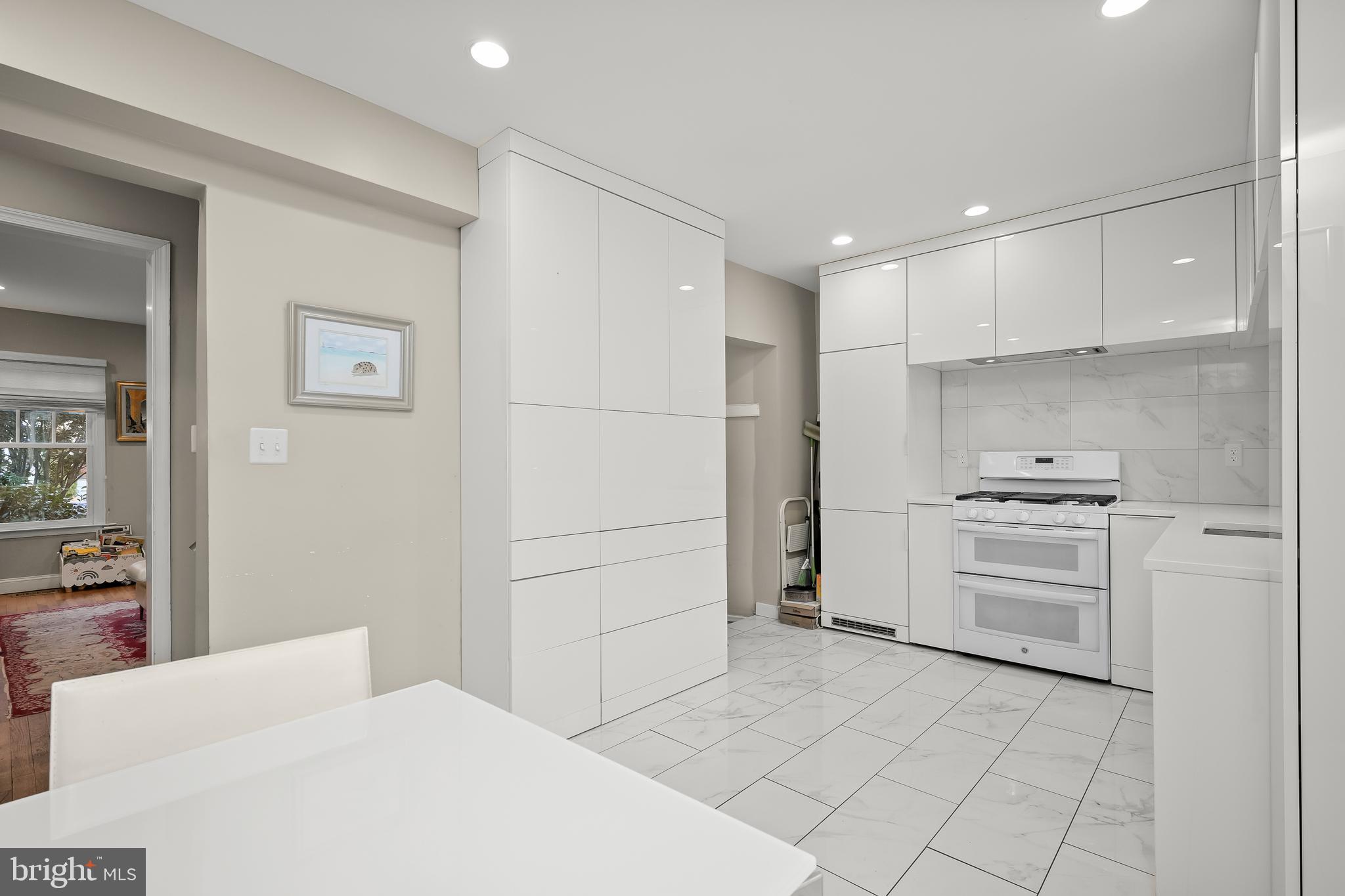1906 37th Street Northwest Washington, DC 20007 - Photo 12 of 22 a kitchen with a stove cabinets and a refrigerator