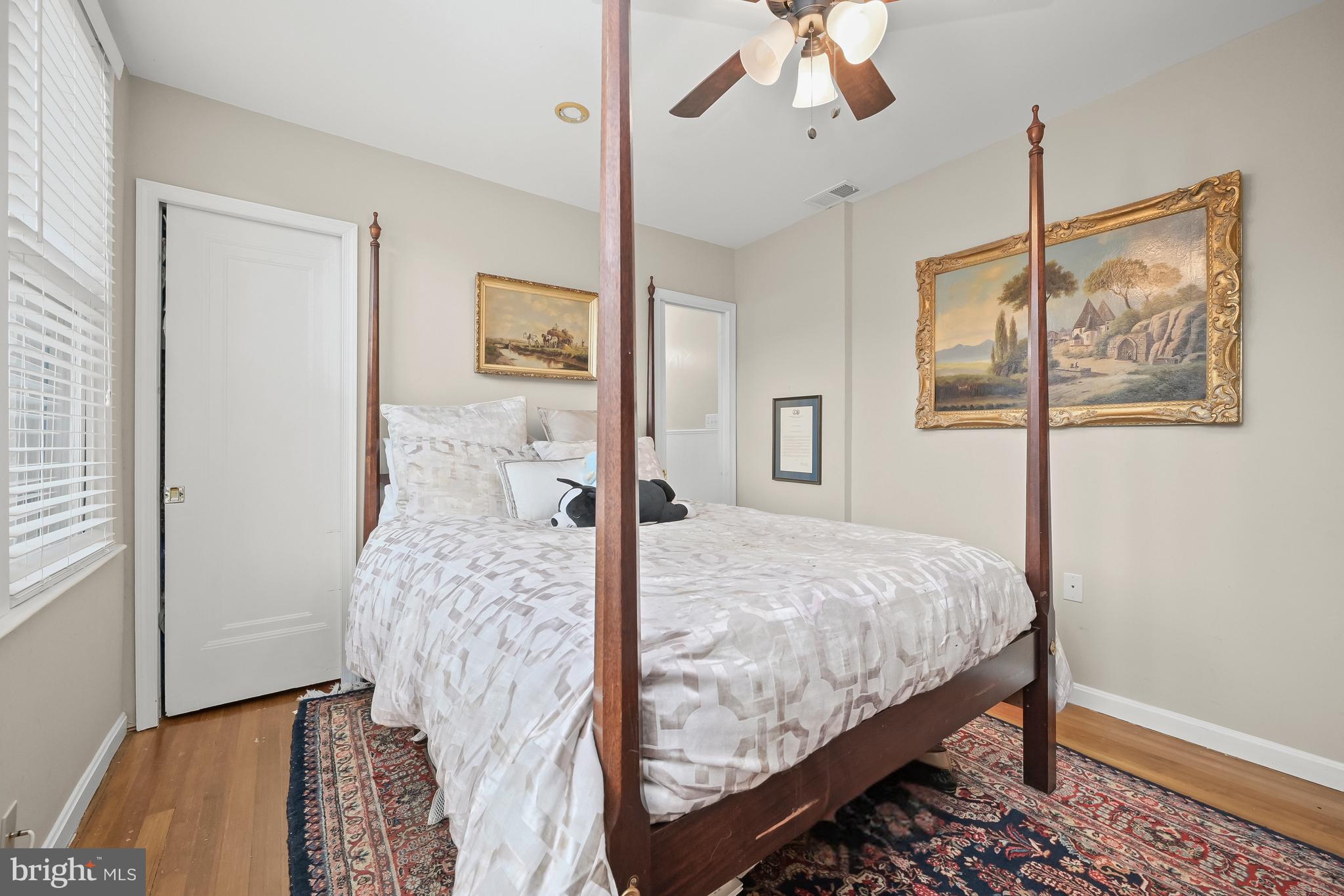 1906 37th Street Northwest Washington, DC 20007 - Photo 14 of 22 a bedroom with a bed and a dresser