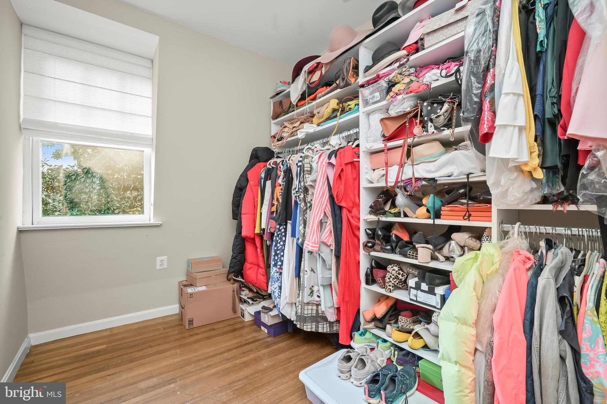 1906 37th Street Northwest Washington, DC 20007 - Photo 17 of 22 a view of walk in closet with clothes and shoes