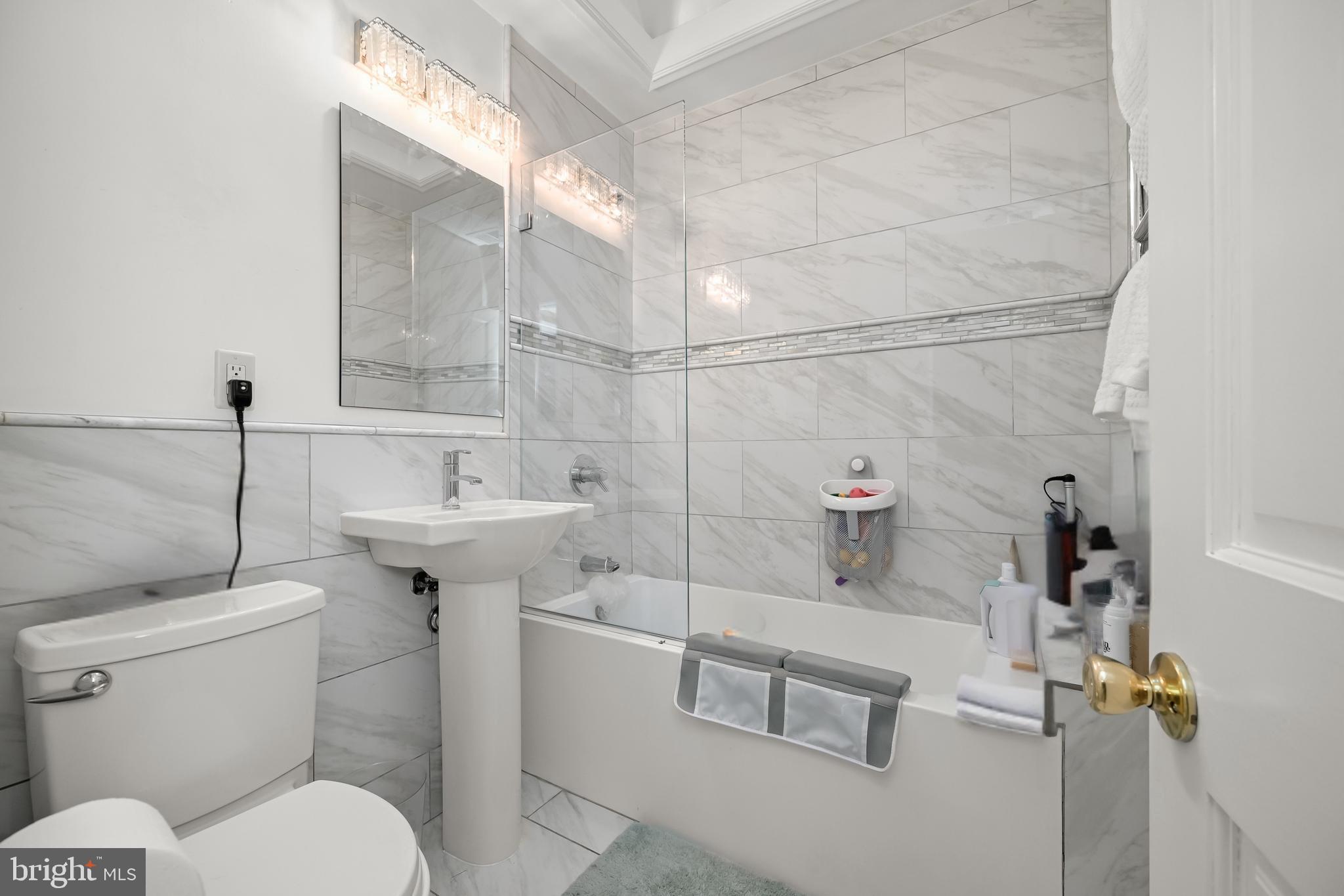 1906 37th Street Northwest Washington, DC 20007 - Photo 18 of 22 a bathroom with a sink a toilet and shower