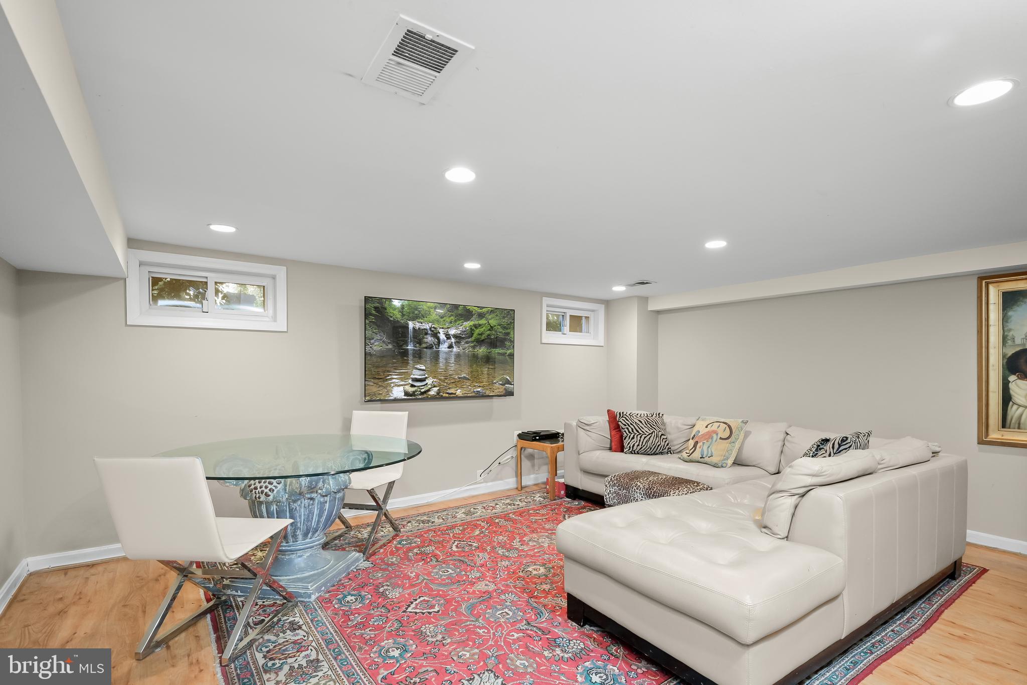 1906 37th Street Northwest Washington, DC 20007 - Photo 19 of 22 a living room with furniture and a rug