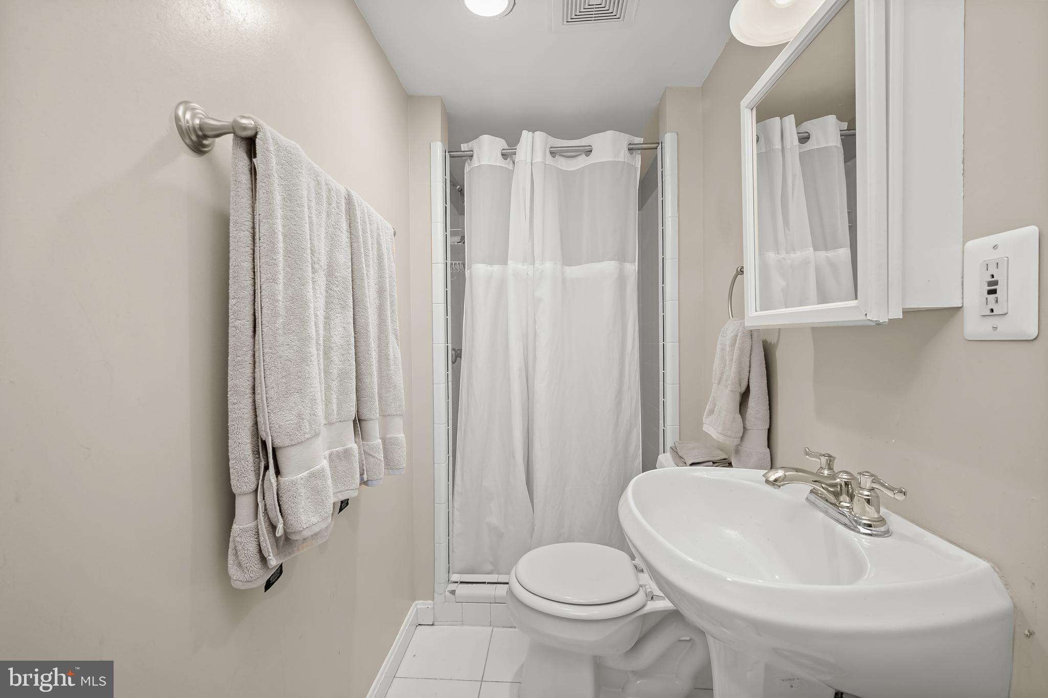 1906 37th Street Northwest Washington, DC 20007 - Photo 22 of 22 a bathroom with a sink toilet and shower